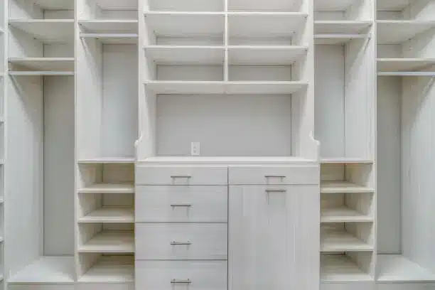 Custom closet system with divided sections for shared kids’ bedrooms