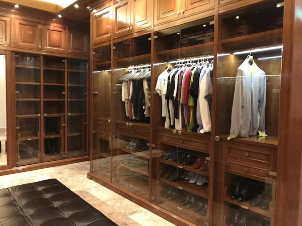 Luxurious custom walk-in closet cabinet with built-in drawers and shelving