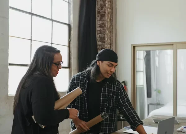 closet design expert planning custom built-in closets with a homeowner