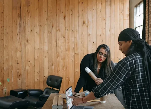 Homeowner discussing garage closet design with a professional consultant