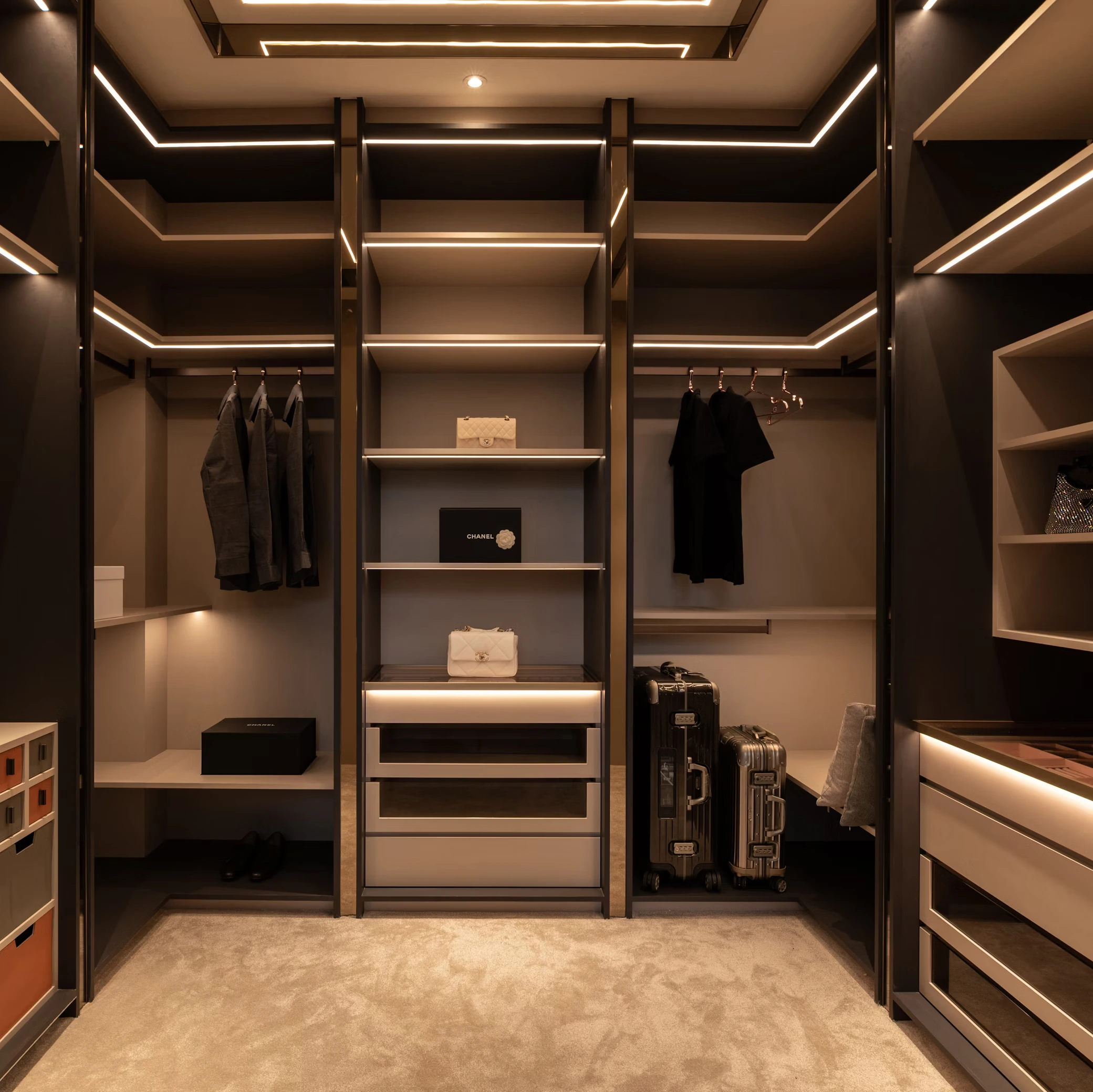 Luxury custom walk-in closet with modern shelving and lighting