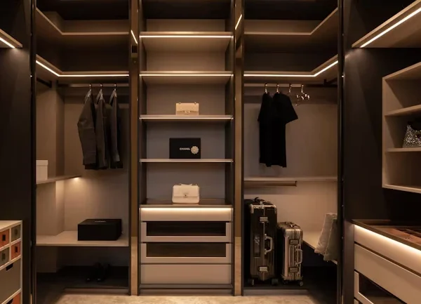 high-end features of a built-in closet systems with lighting and soft-close drawers