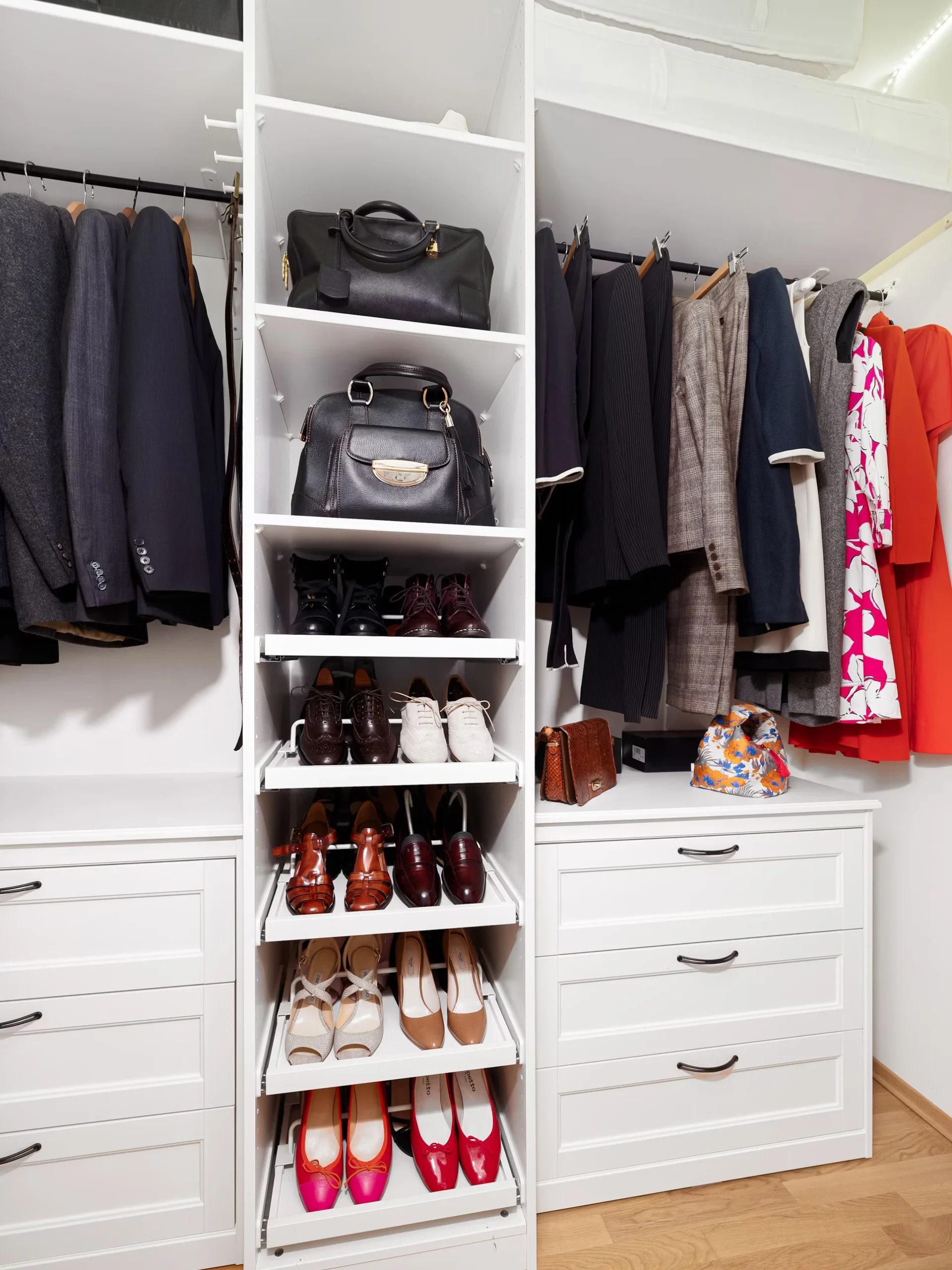 Small walk-in closet with organized shelves and hanging space