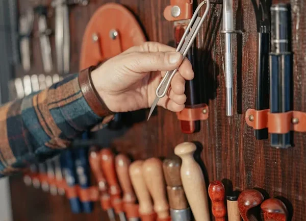 Wall-mounted tool storage system in a garage.