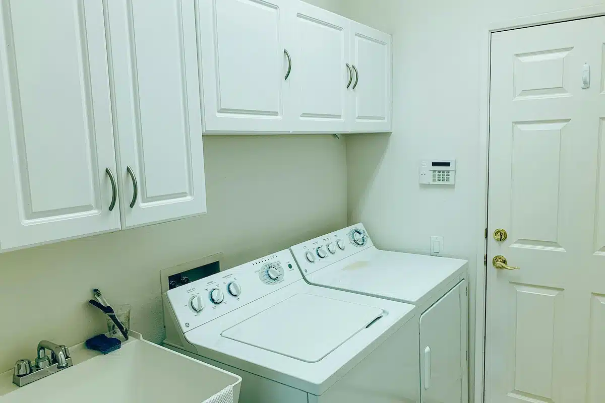 custom laundry room folding counter and lower cabinets for organized storage