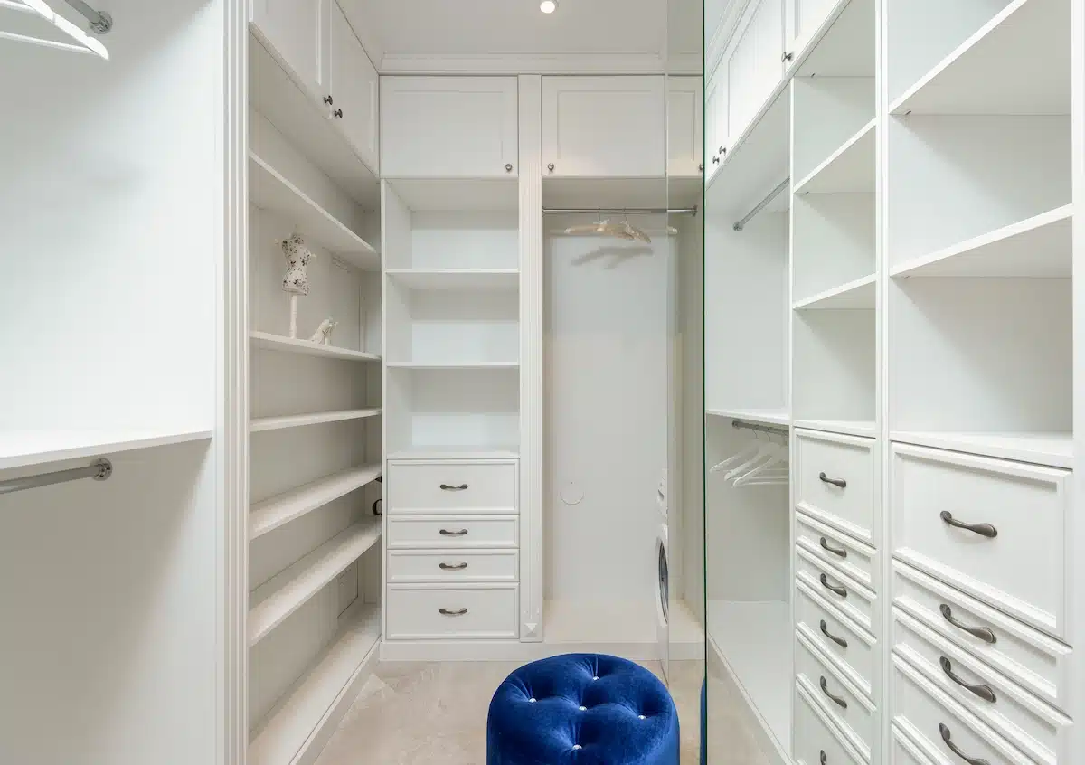 walk-in master closets with his and hers sections and symmetrical custom cabinetry design